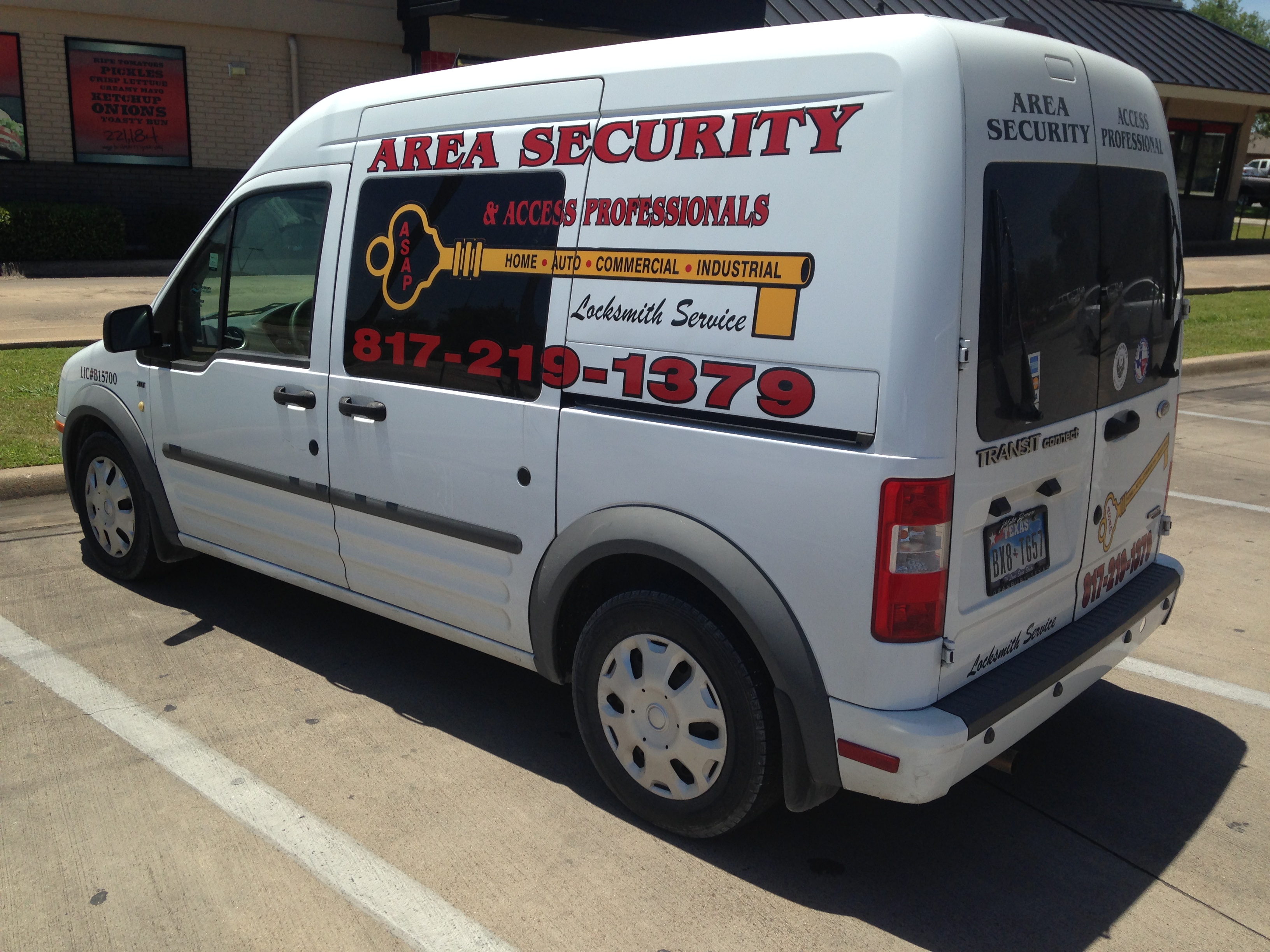 Area Security & Access Professionals Locksmith LLC service van displaying the 817-219-1379 phone number and Home, Auto, Commercial, Industrial service list, the vehicle used for locksmith calls across Granbury, TX